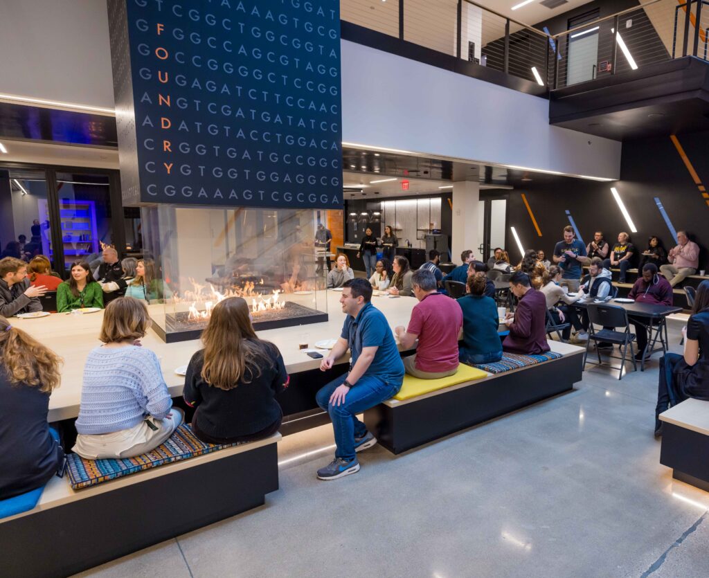 Forge team members gathered around the foundry at the Hearth for an event.