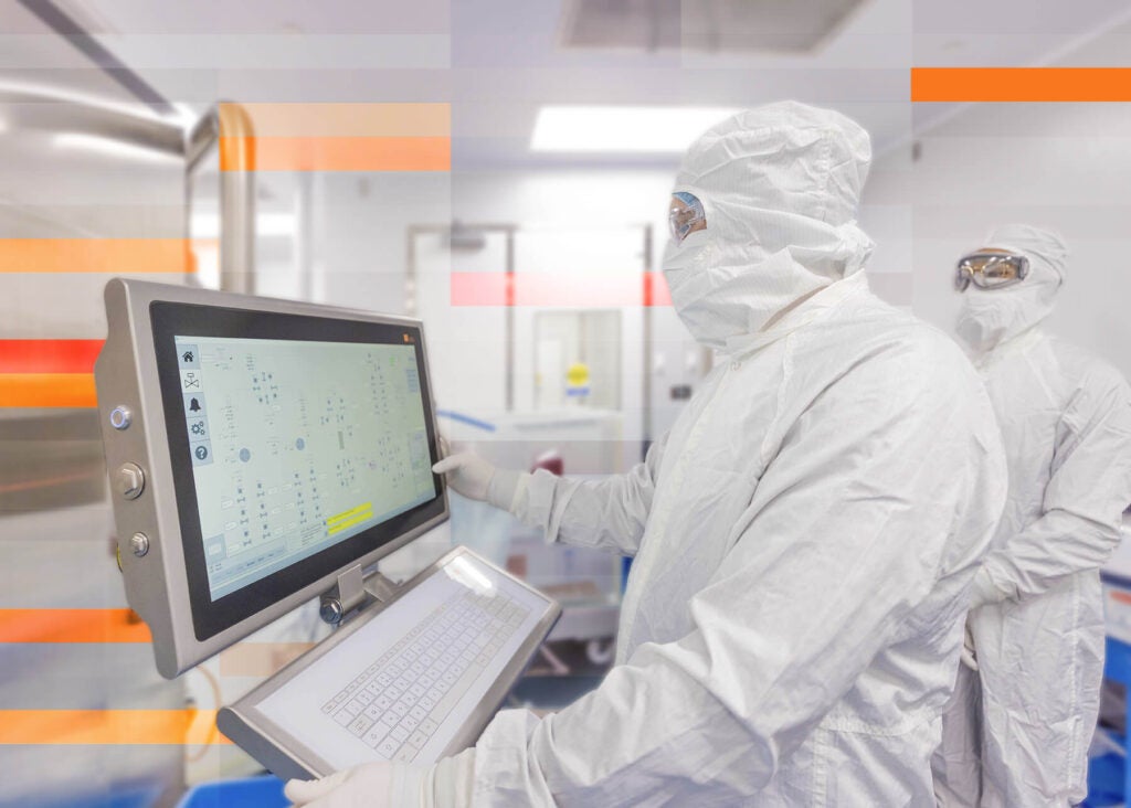 Scientists at Forge Biologics running chromatography in one of our downstream GMP suites.