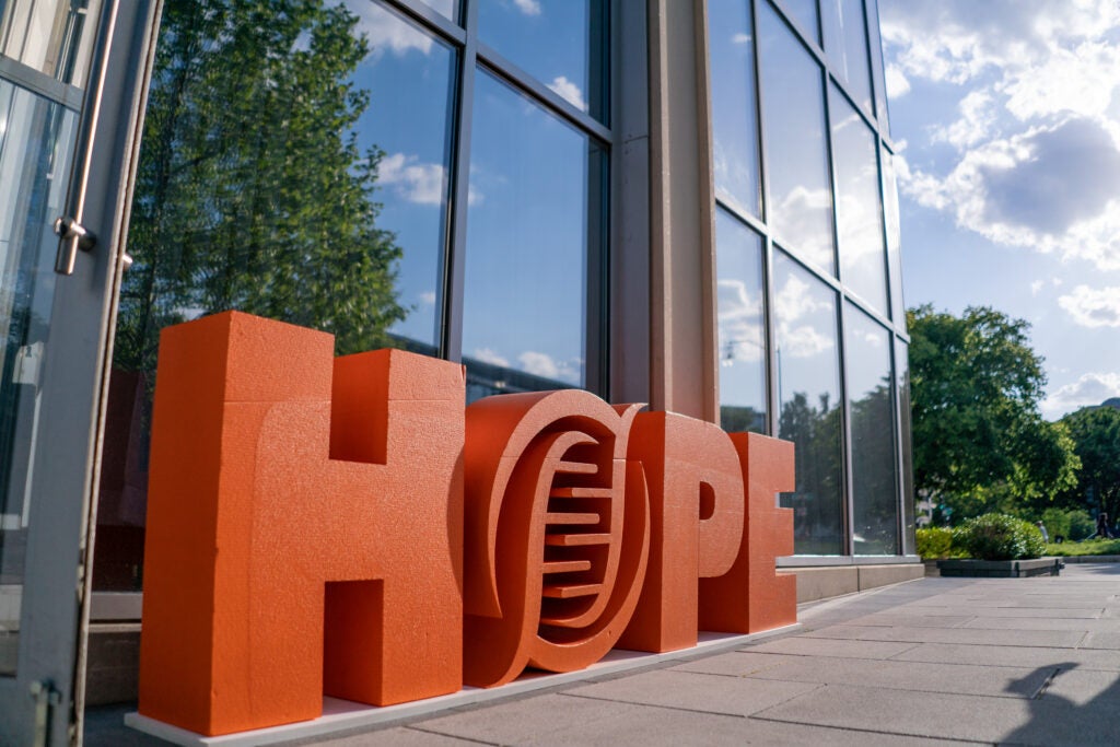 Large HOPE letters with the Forge "O" logo outside of a reception location during an ASGCT annual meeting.