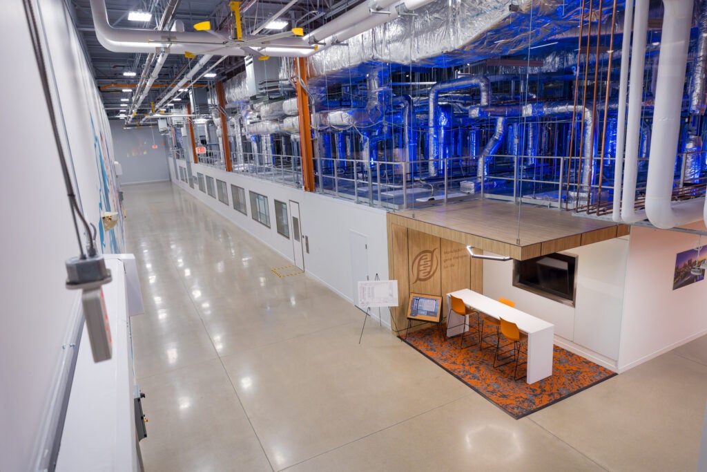 A view of cGMP suites at the Hearth down "Main Street" with sight of the air handling systems above.